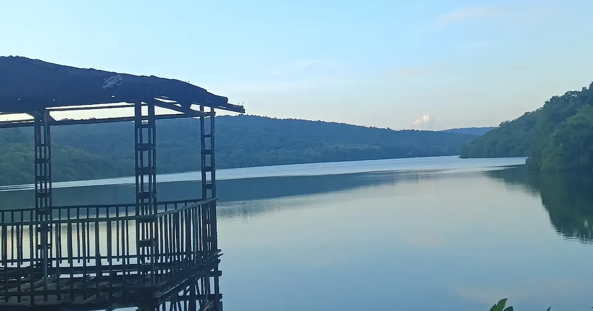 Scenic view of Dhamapur Lake, a heritage or nature destination in Kokan